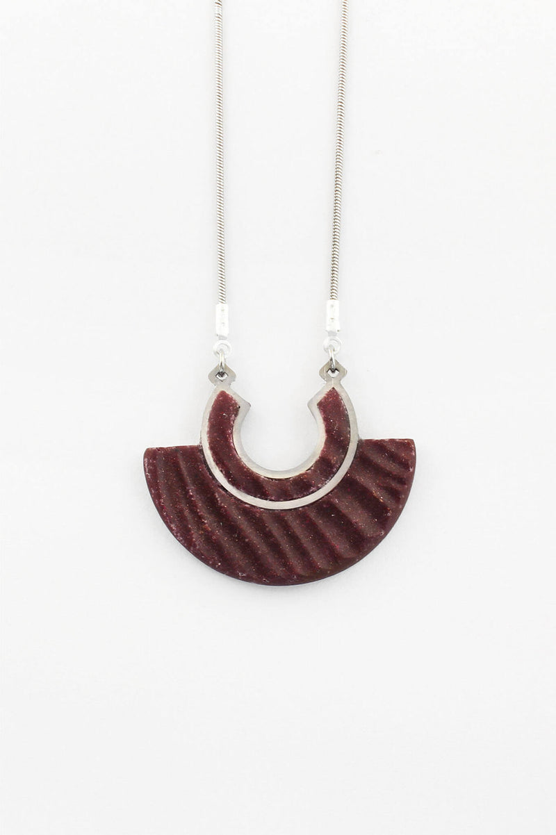 The Aurora pendant necklace, made of dark red burgundy eco-friendly resin and hypoallergenic stainless steel chain, handmade