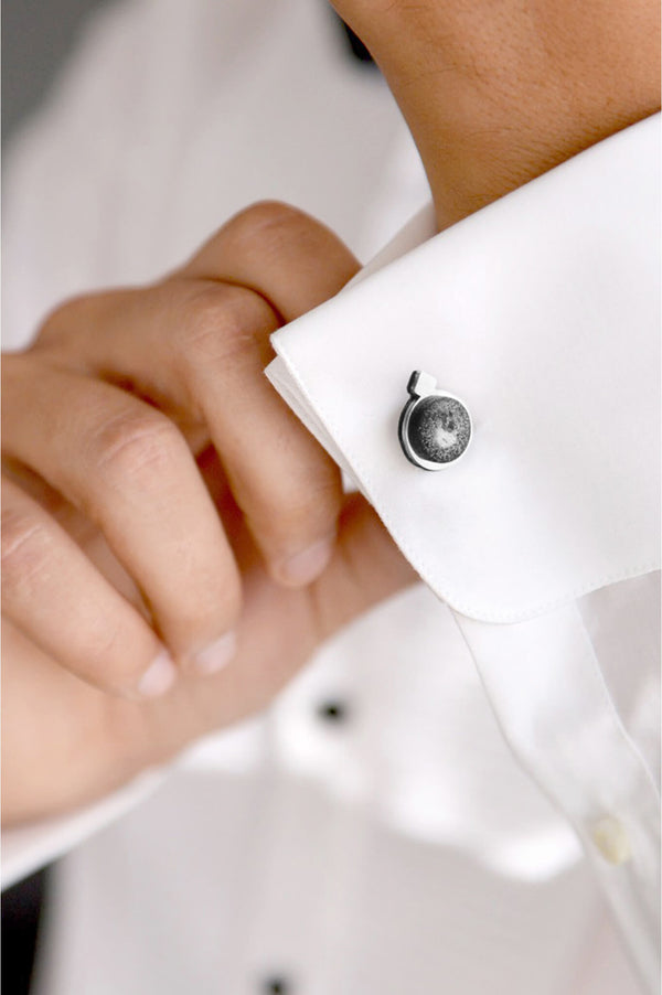 male model wearing handmade Echo cufflinks in marbled black and white resin and stainless steel