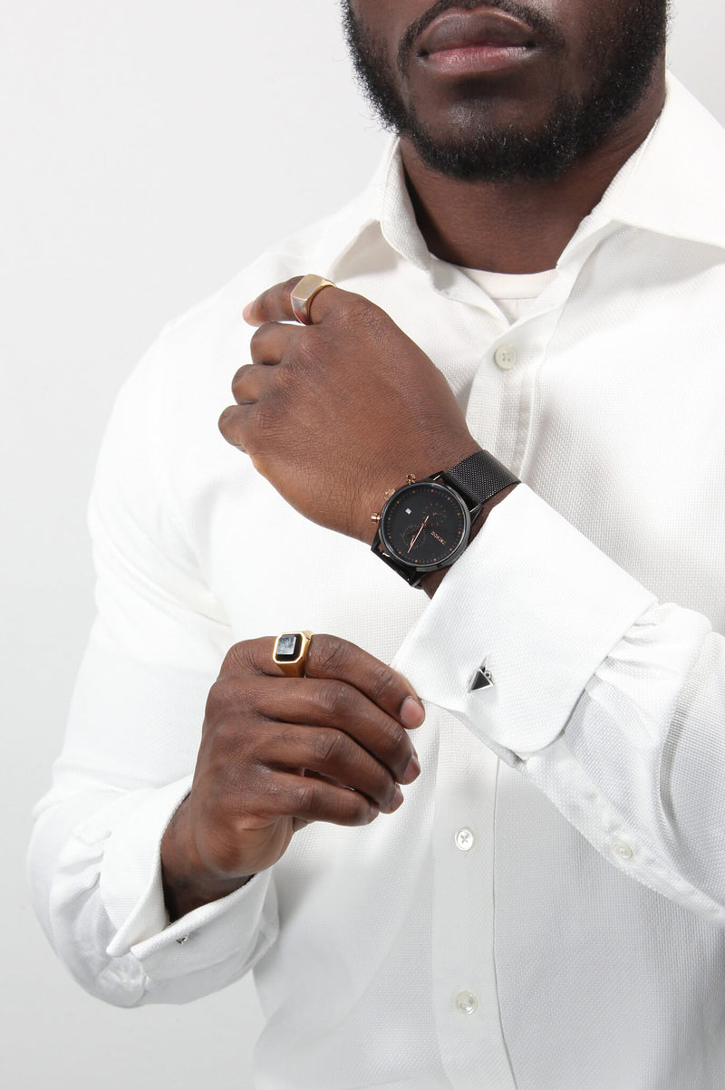 male model in business attire wearing Bijoux Pépine's Echo, handmade triangular cufflinks in black 