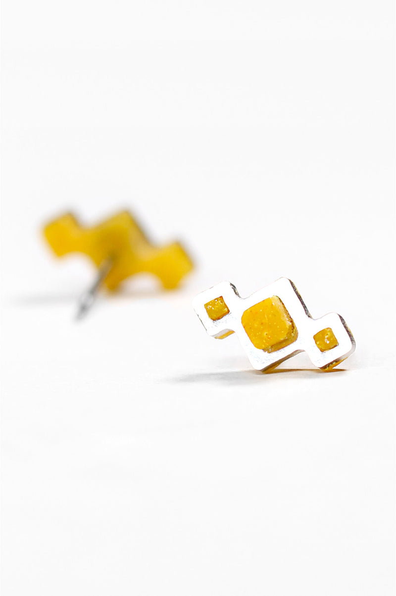 Pineale, small geometric studs handmade with golden ochre yellow resin and hypoallergenic stainless steel