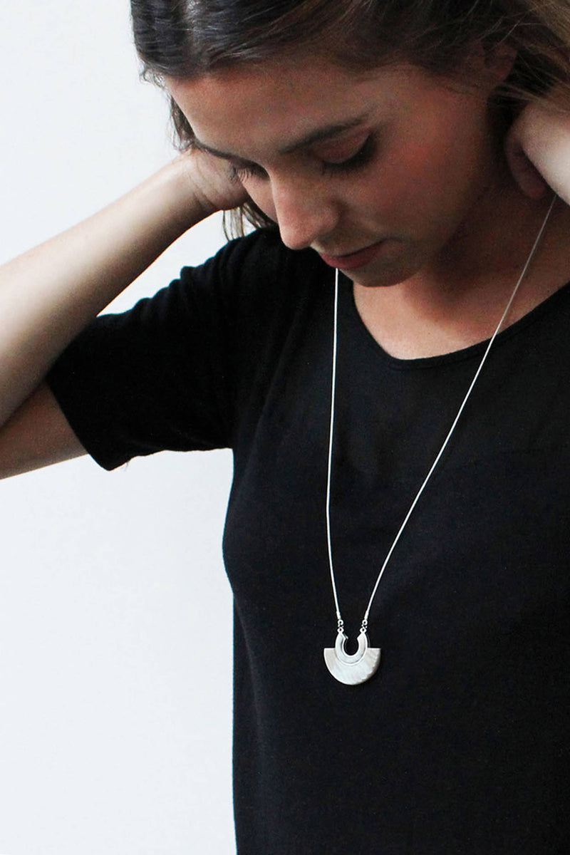 model wearing Aurore beige resin and hypoallergenic stainless steel necklace handmade 