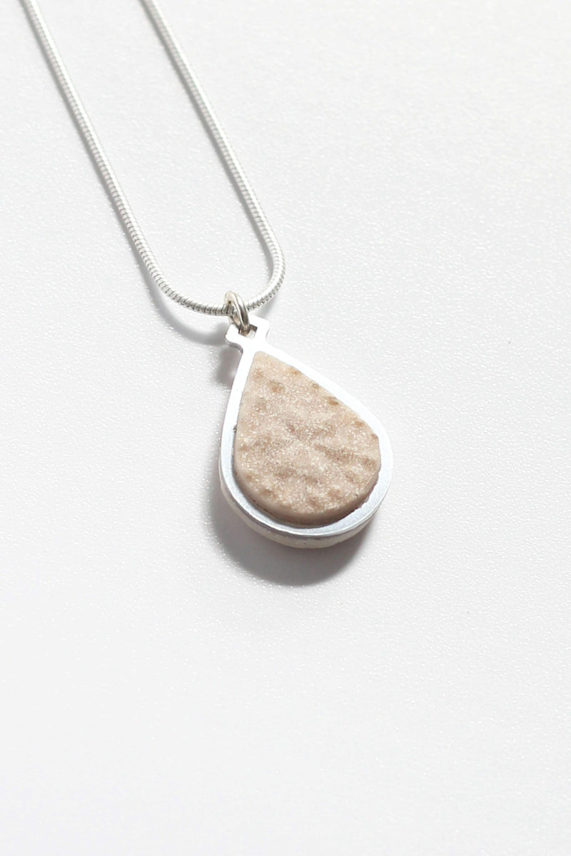 Candide teardrop adjustable length necklace in beige resin and hypoallergenic stainless steel