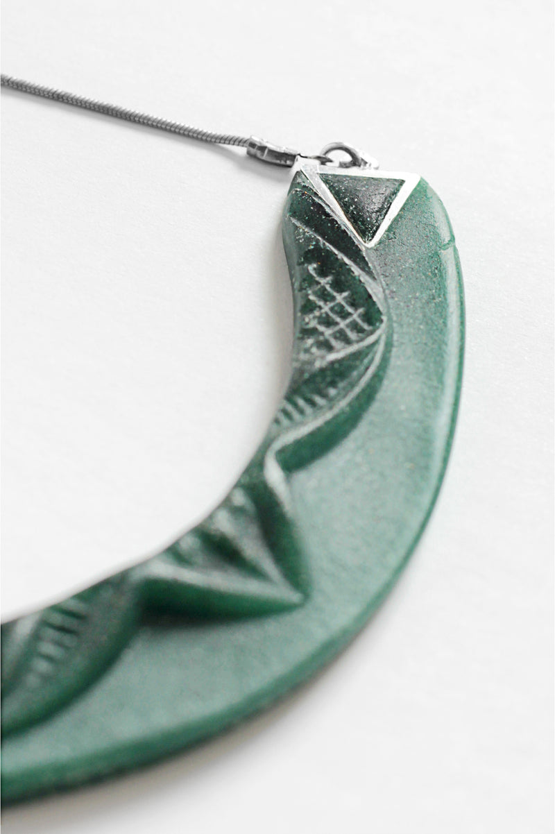 close-up of Couronne, handmade necklace in forest green resin and hypoallergenic stainless steel