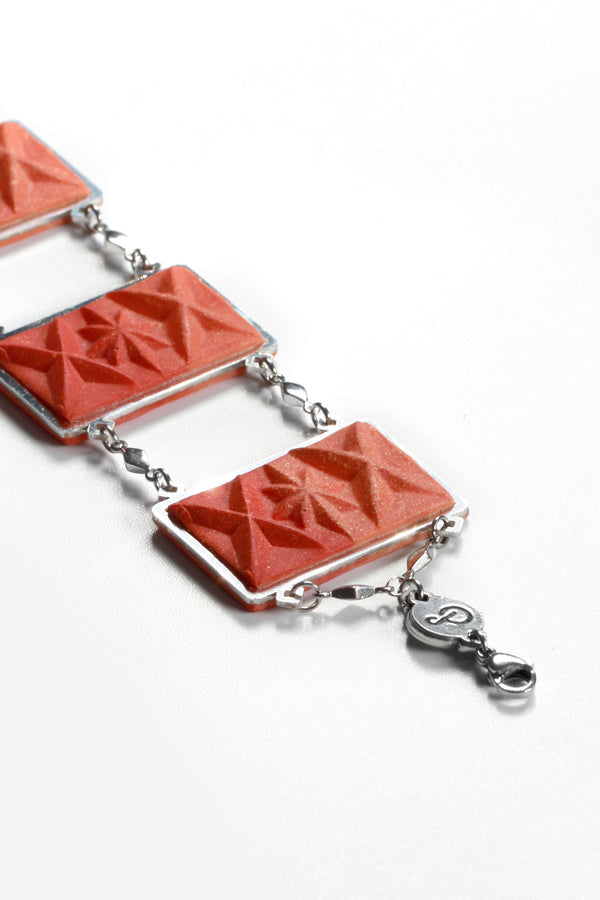 fashion flat lay of Bijoux Pépine's Dihya, luxury bracelet and necklace in red coral resin and hypoallergenic stainless steel