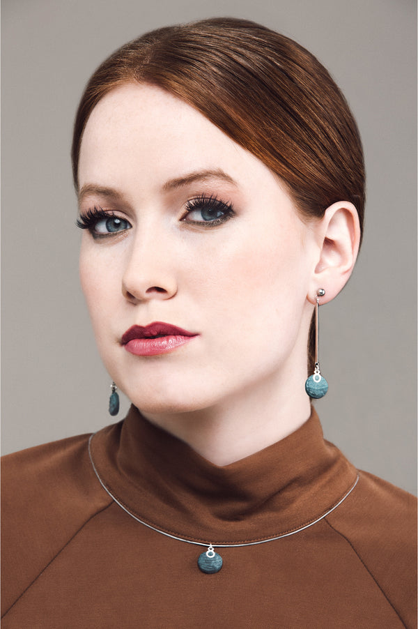 model wearing Montreal handmade Dune earrings and necklace in two-toned forest green by Bijoux Pépine