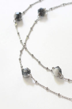 Hasard, handmade luxury necklace in marbled black and white resin and hypoallergenic stainless steel
