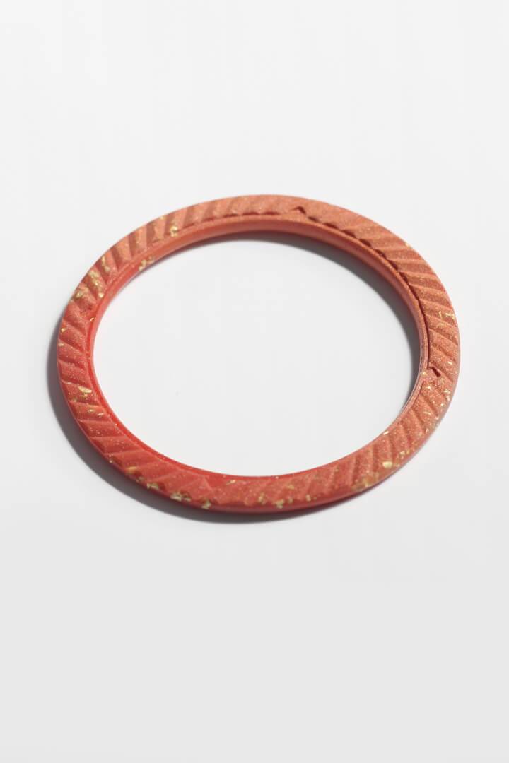 Ouroboros bracelet, Bijoux Pépine’s handmade bangle bracelet in red coral color eco-friendly resin and 24 karat gold leaf, handmade process