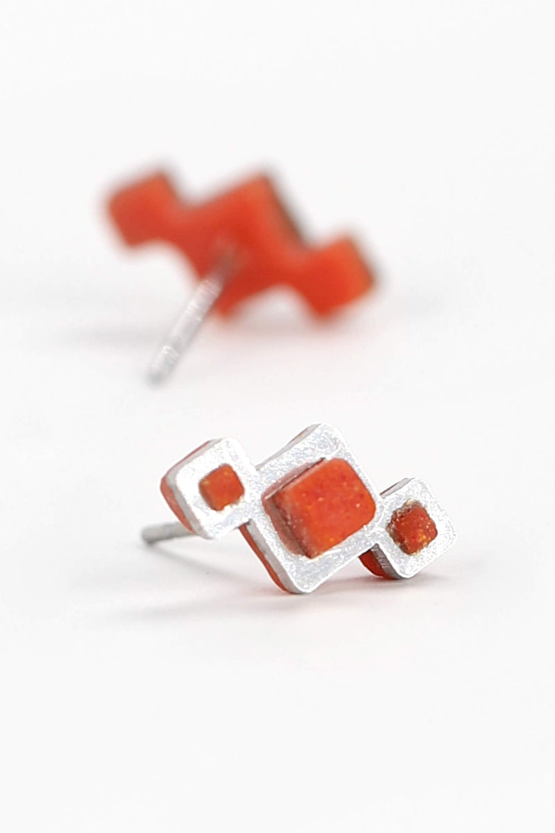 Pineale, small geometric studs handmade with red coral resin and hypoallergenic stainless steel