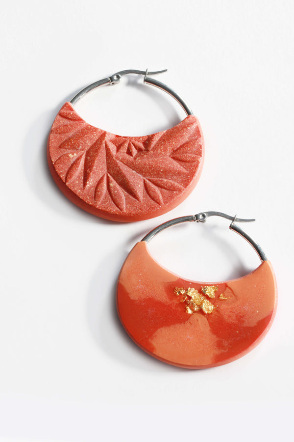 Séléné, coral red resin and 24 karat gold leaf luxury hoop earrings handmade by Bijoux Pépine